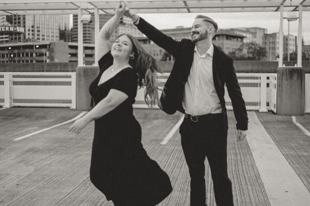 Candid moment between couple on rooftop parking garage, Cincinnati engagement shoot